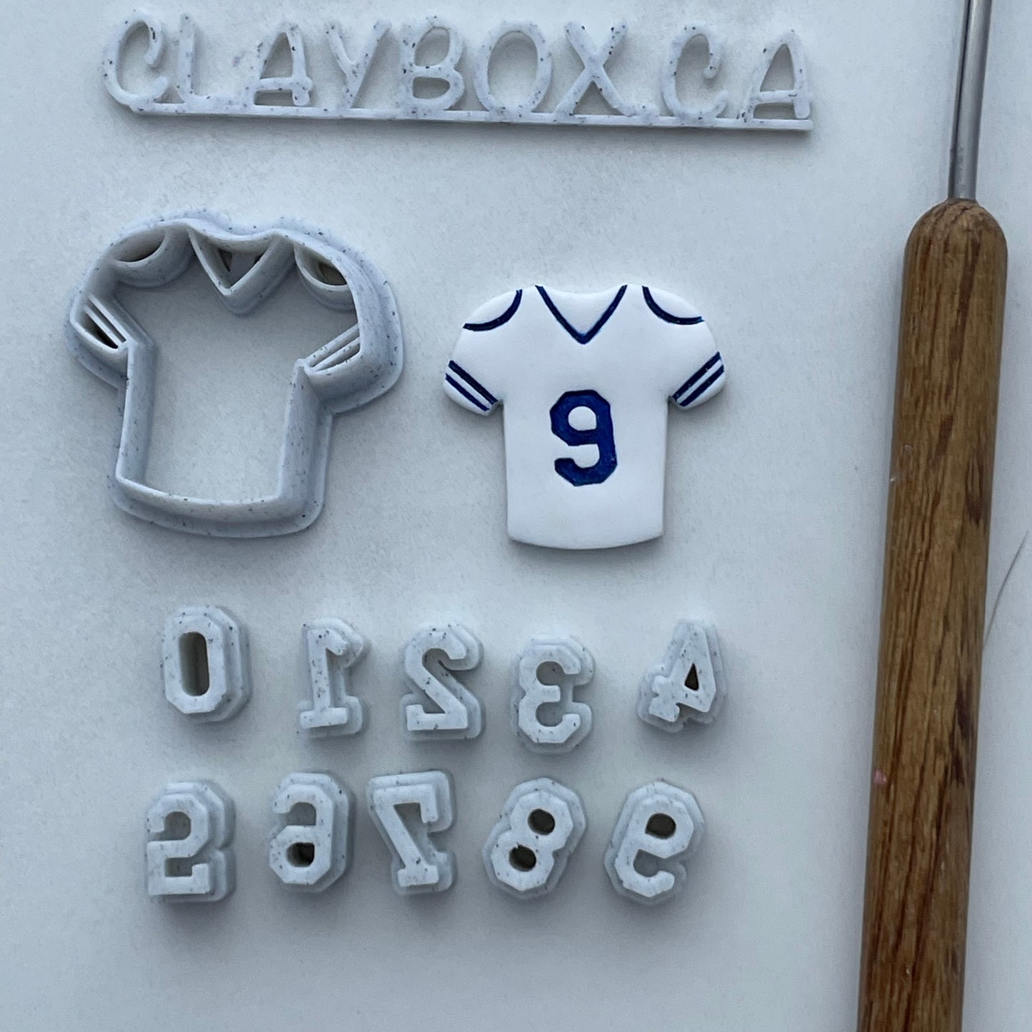 Football jersey cutter with number stamps