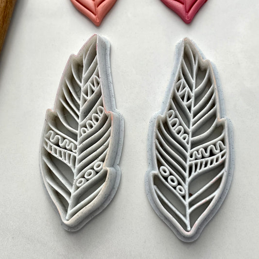 Tribal feather cutter pair